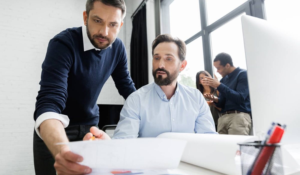focused-business-team-working-with-documents-P67NT9G.jpg